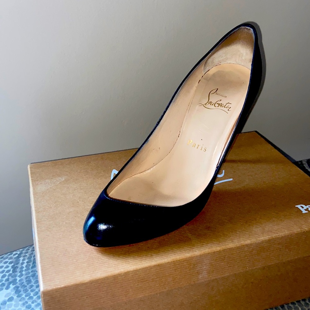 Authentic Christian Louboutin. Very Sexy/ Not your average black pump!!!!